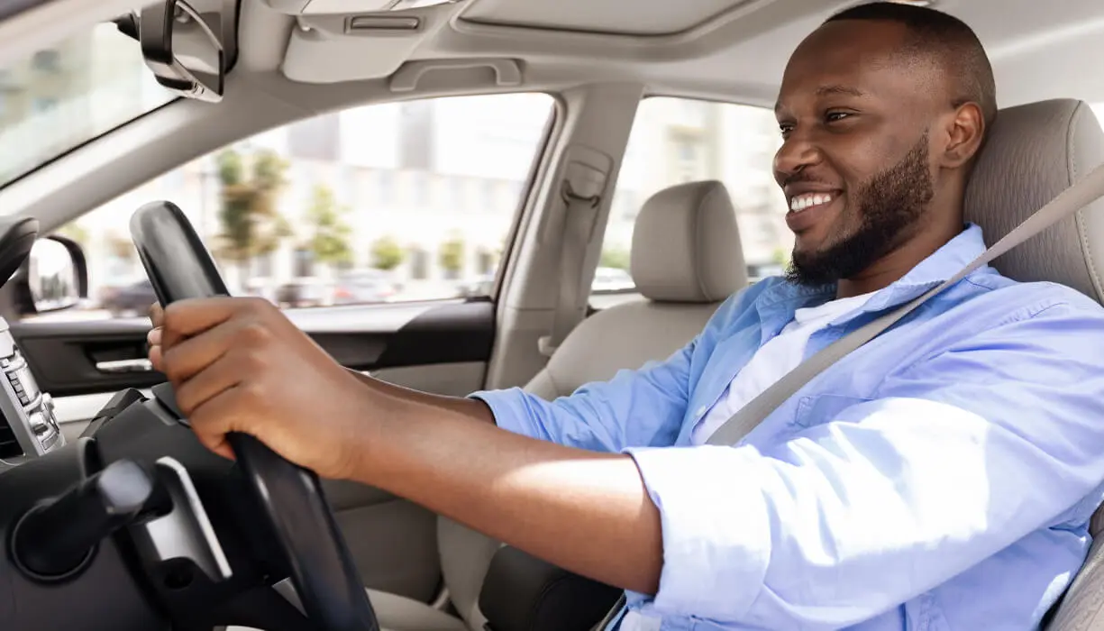 A young man driving his car in Florida after filing FR-44